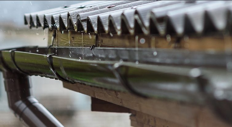 Rainwater running off a gutter